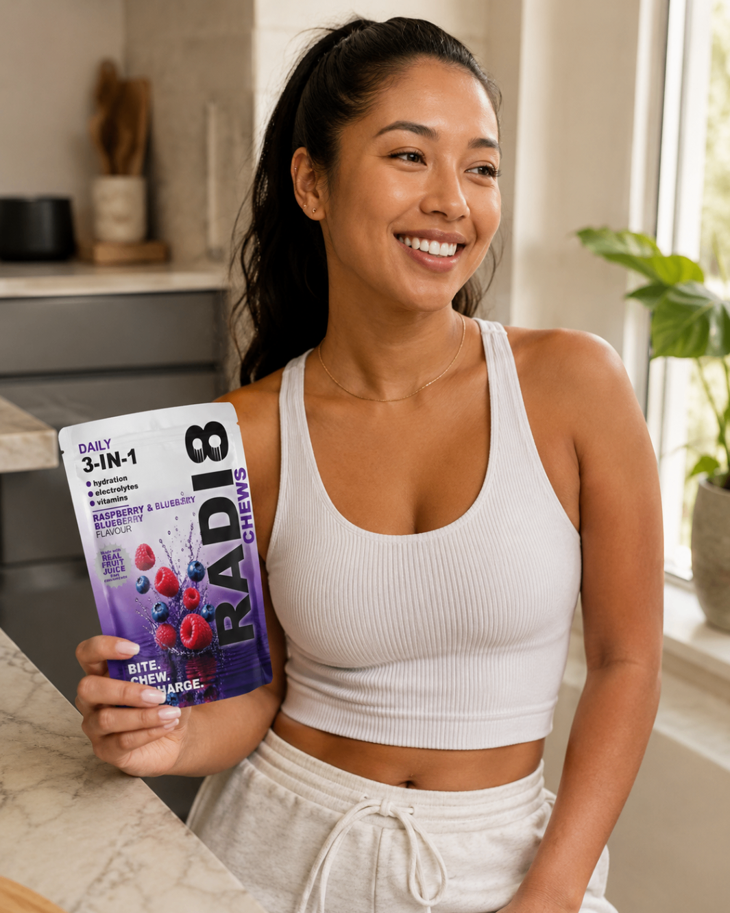 Radi8 Chews Raspberry and Blueberry pouch held in hand